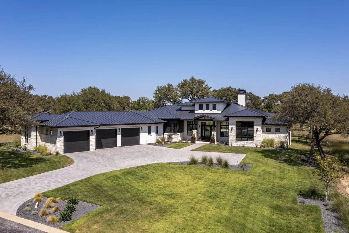 Modern home with paver motor court