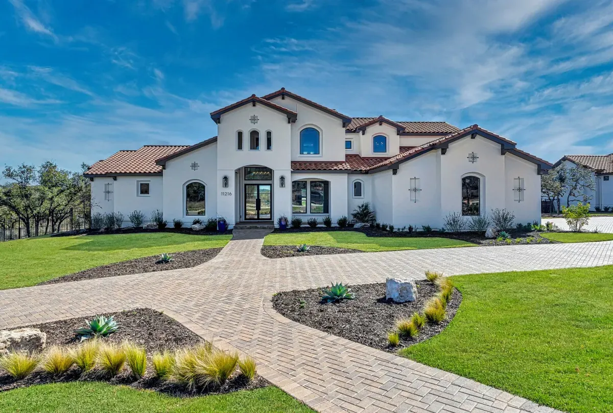 Herringbone paver driveway at a Spanish-style home
